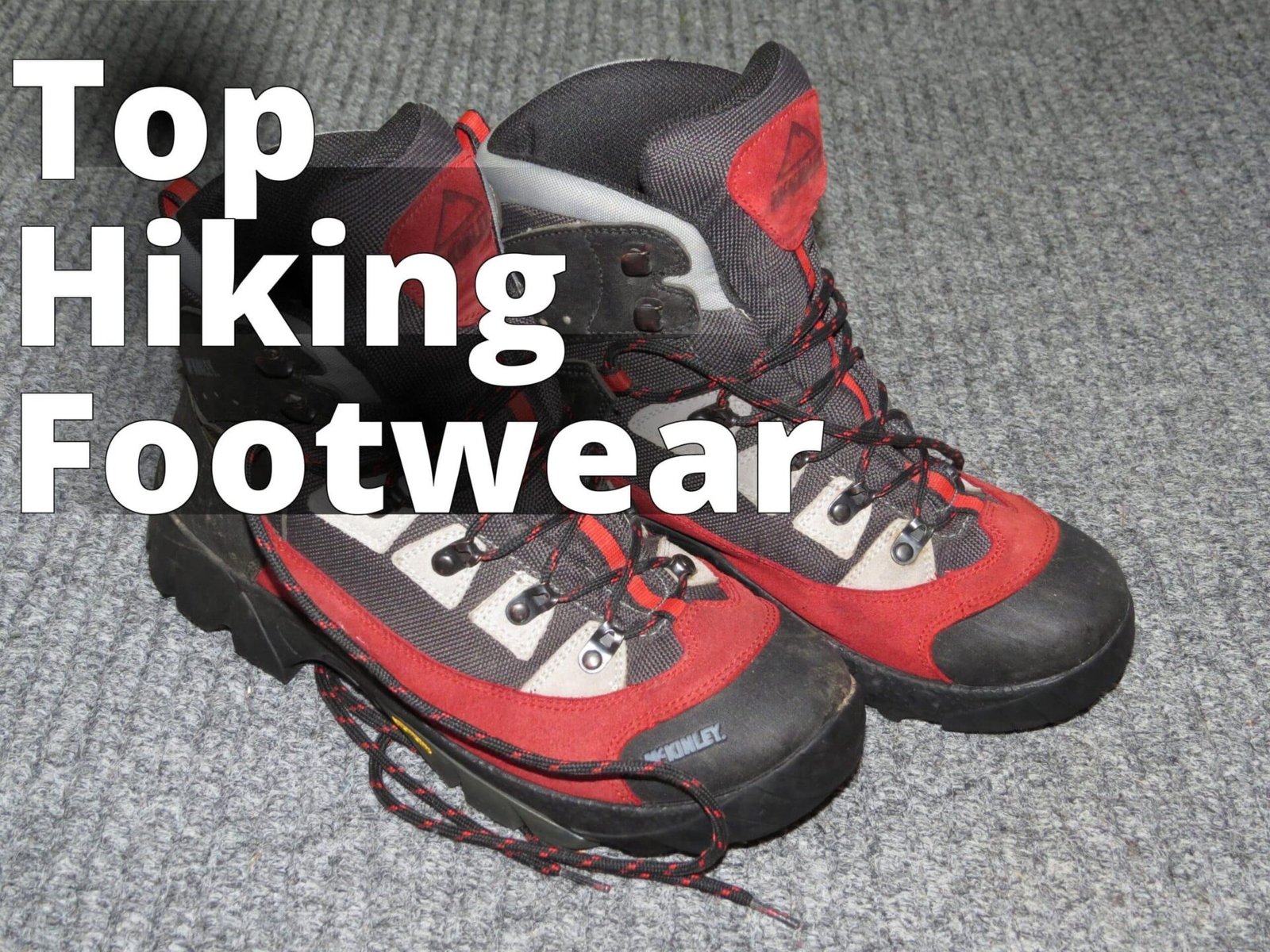 2018-01-01 (212) McKinley Hiking boots - a pair of red and black shoes on a carpet